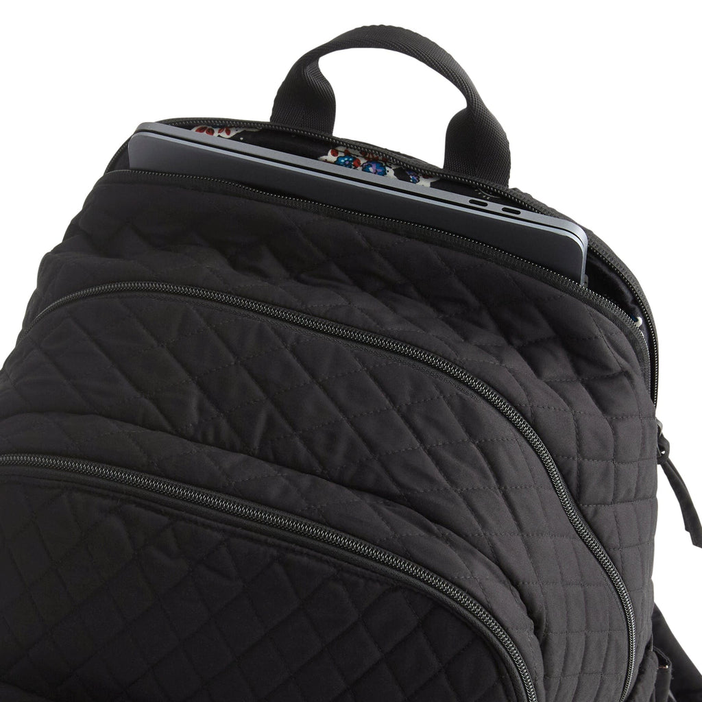 Black quilted backpack with a laptop compartment on a white background
