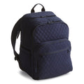 Navy blue quilted backpack on a white background