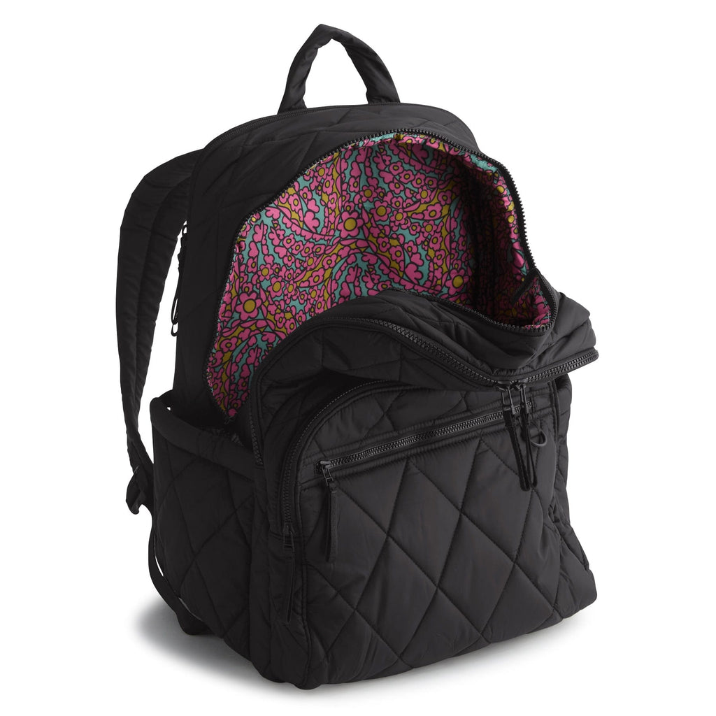 Black quilted backpack with colorful interior lining on a white background