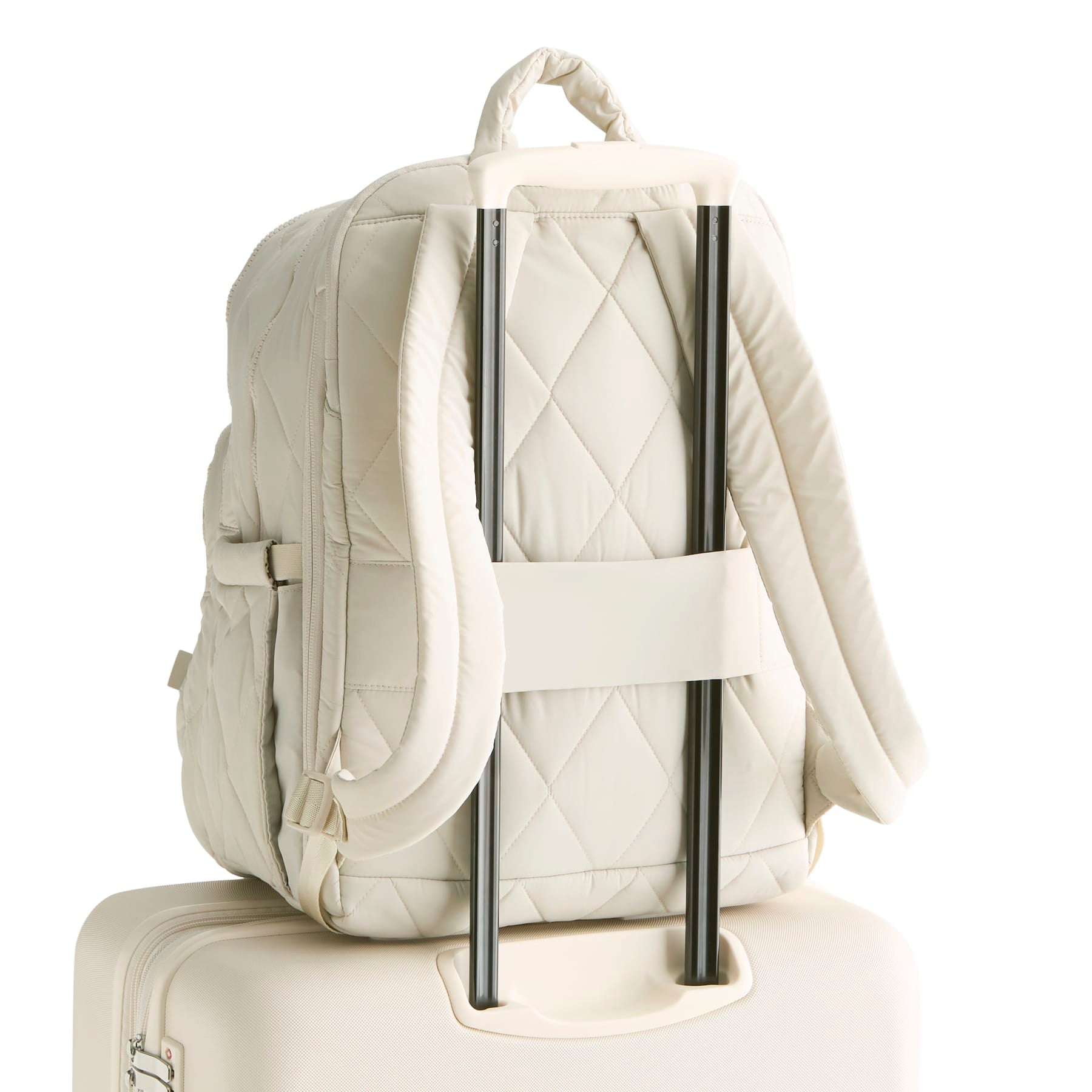 White quilted backpack with straps on a white background