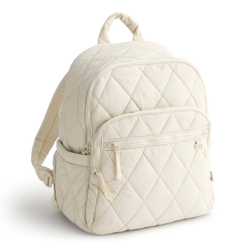 Quilted beige backpack on a white background