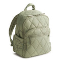 Green quilted backpack on a white background