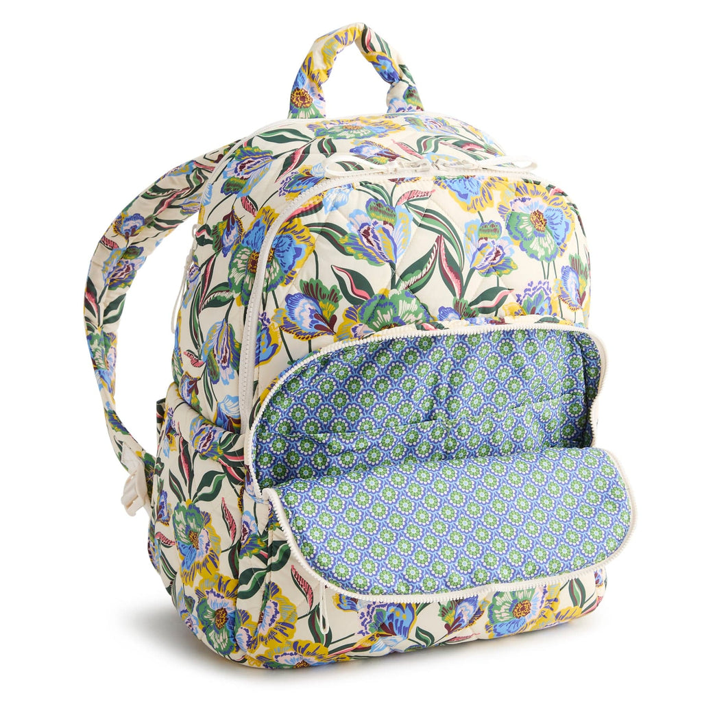 Floral-patterned backpack with a blue interior on a white background