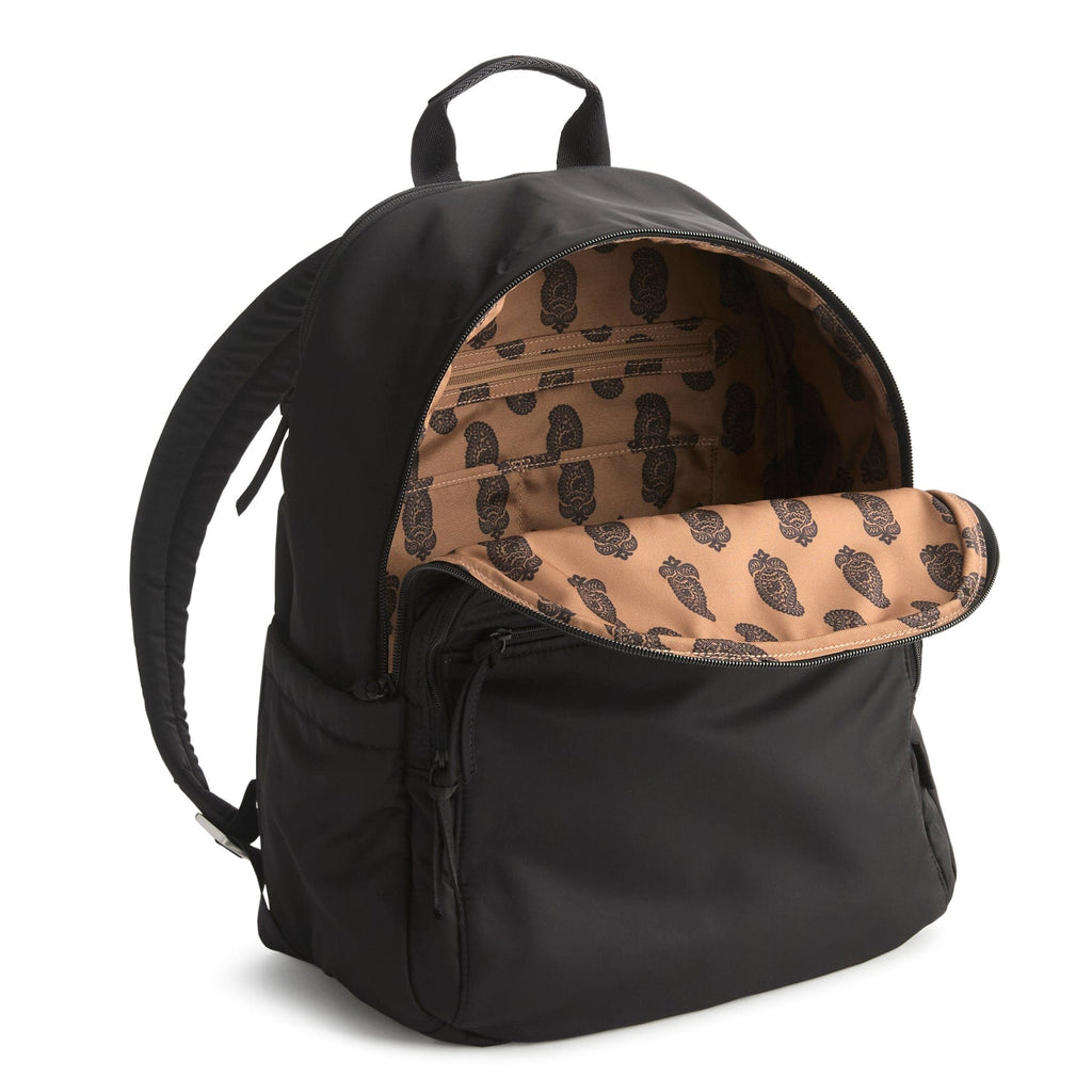 Black backpack with a tan interior featuring a pattern on a white background