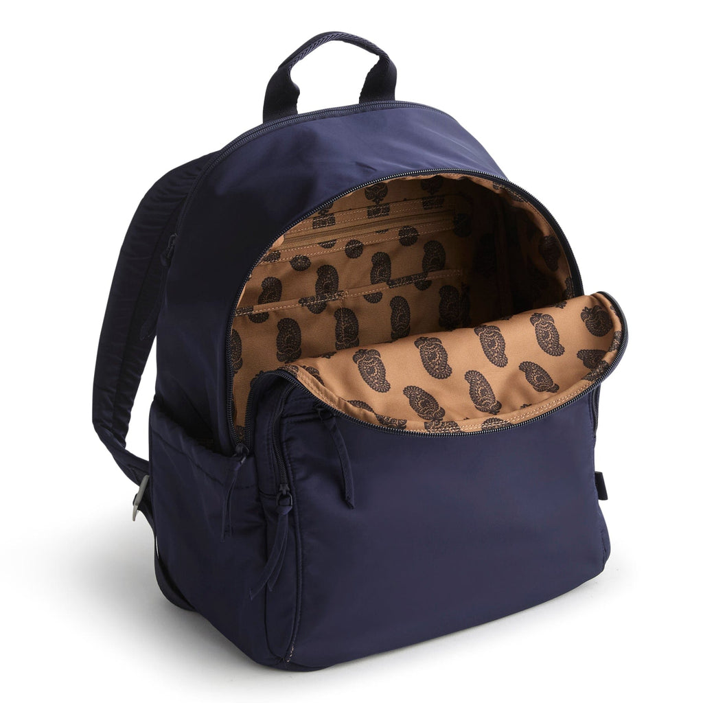 Navy blue backpack with open front pocket showing beige interior