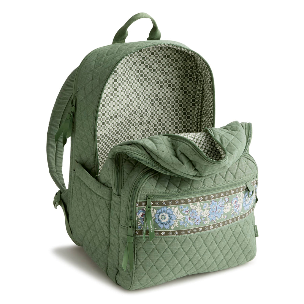 Green quilted backpack with floral pattern on a white background