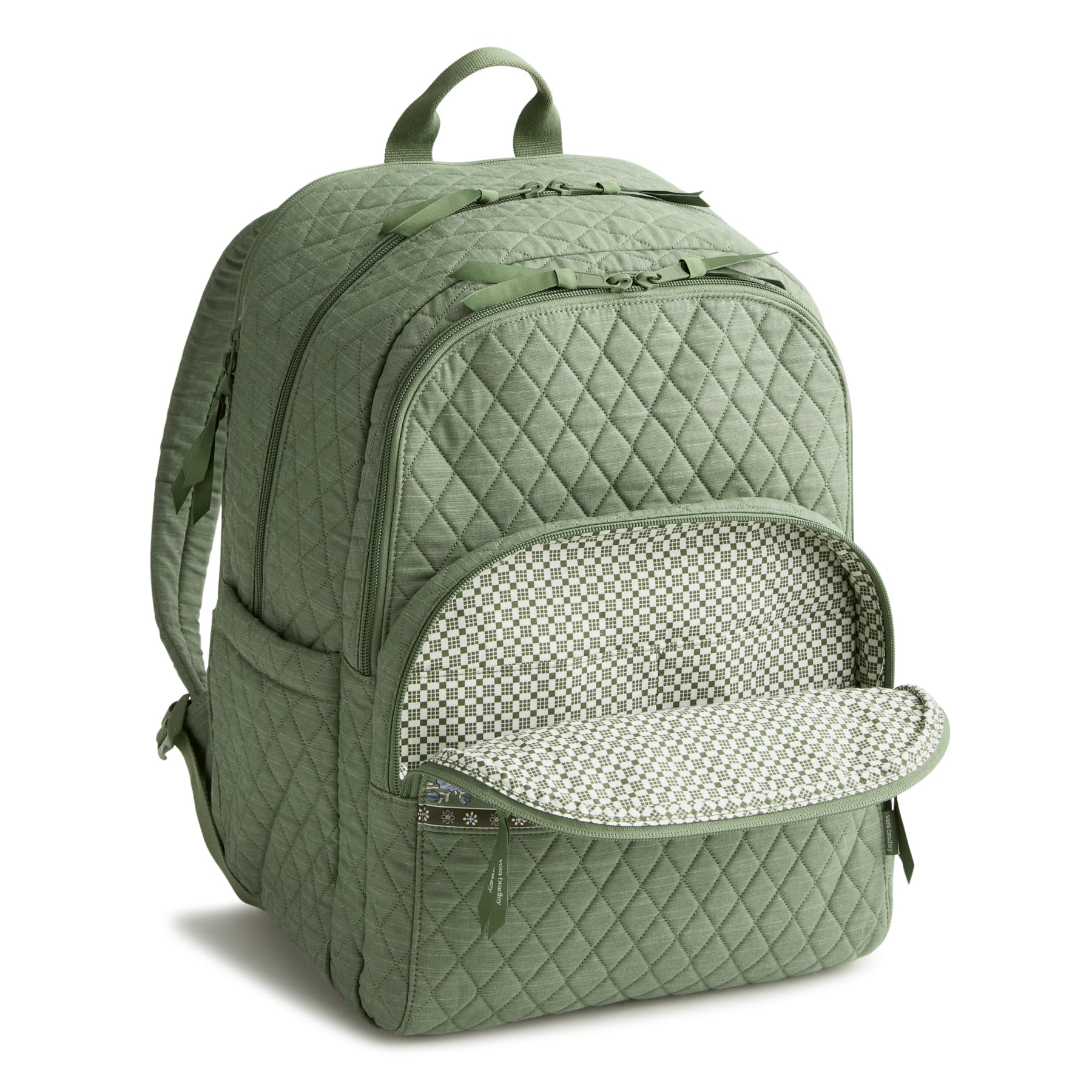 Green quilted backpack with open front compartment on a white background