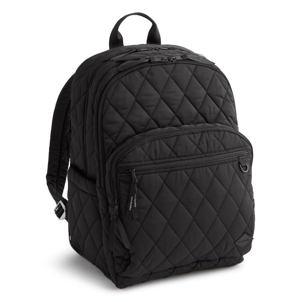 Black quilted backpack on a white background