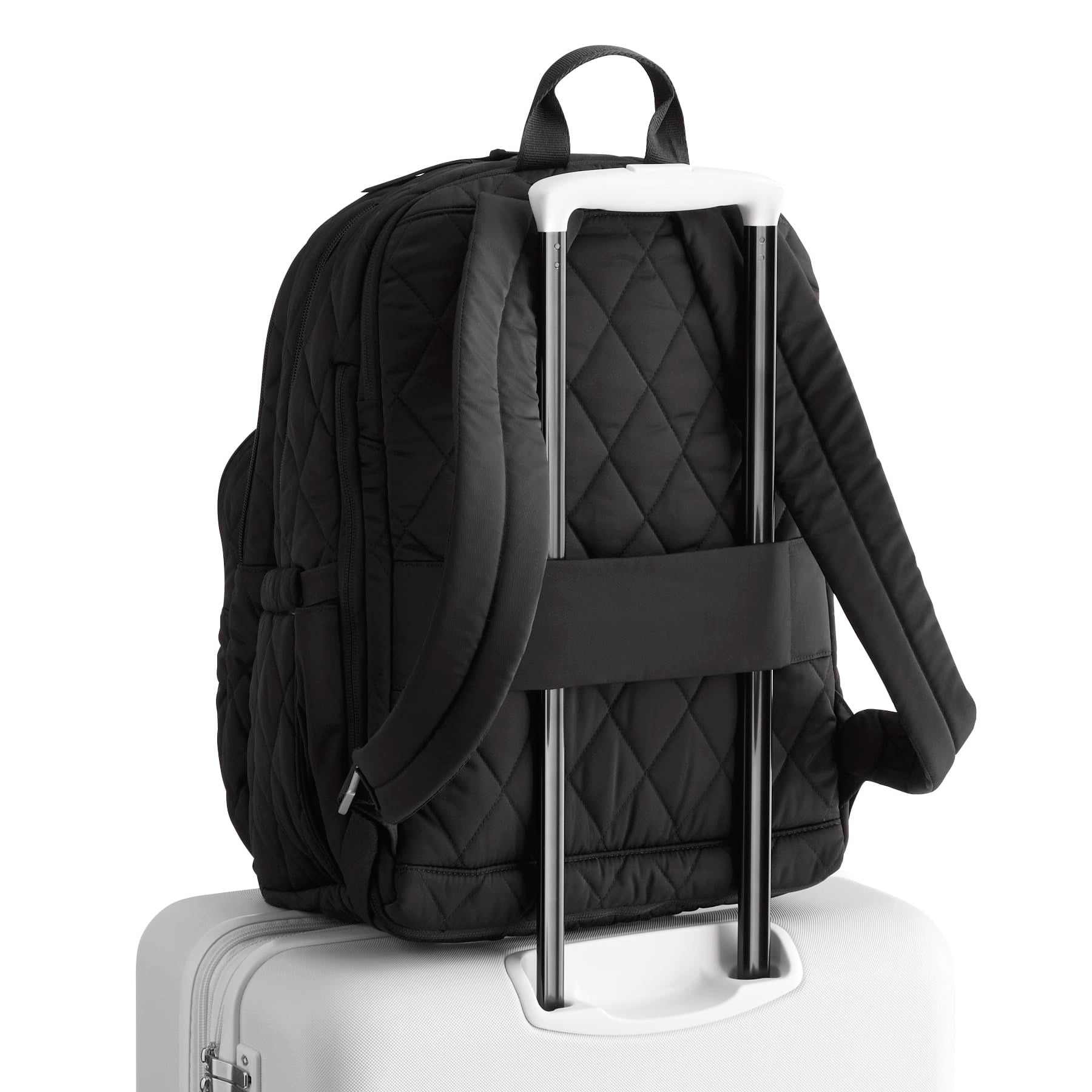 Black backpack with a luggage handle attached on a white background