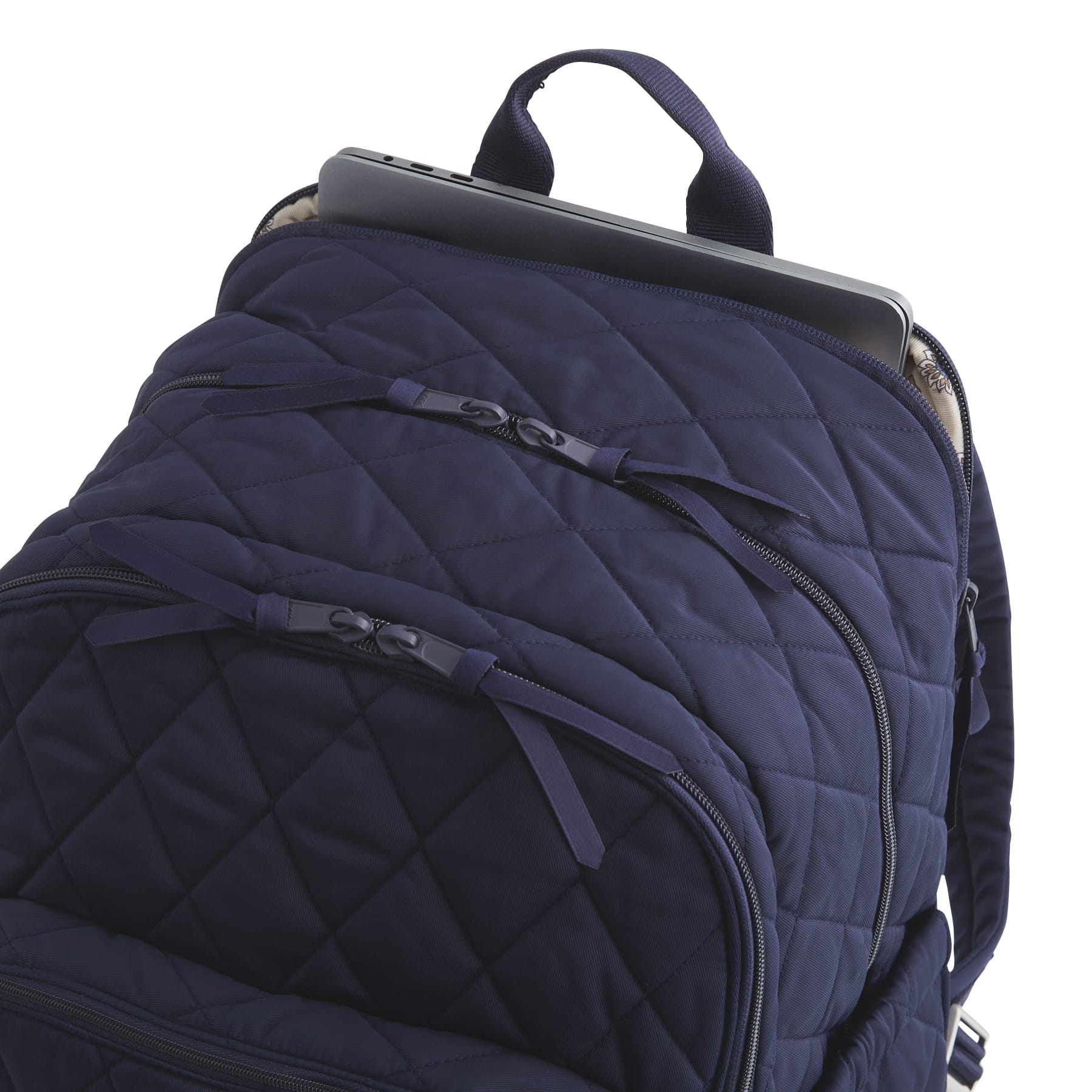 Navy blue quilted backpack with a laptop compartment on a white background