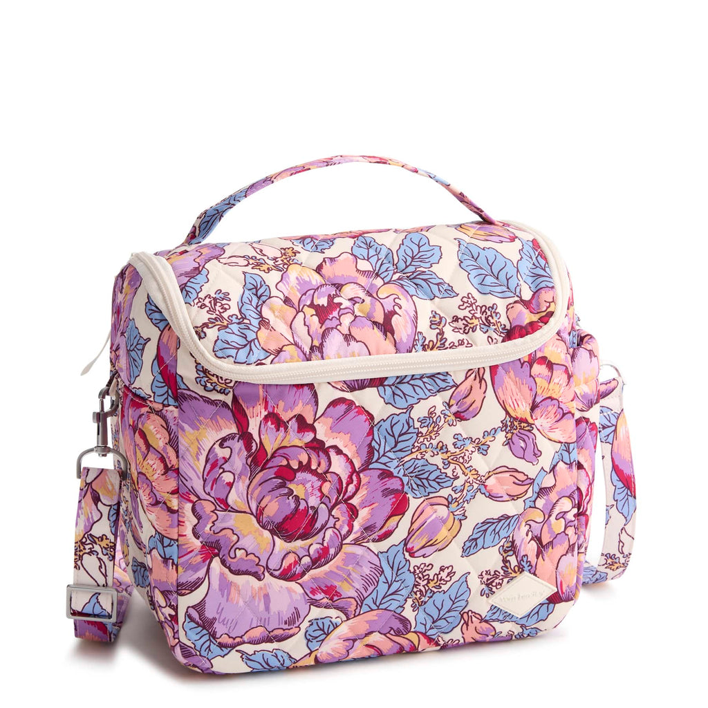 Floral patterned bag with a strap on a white background